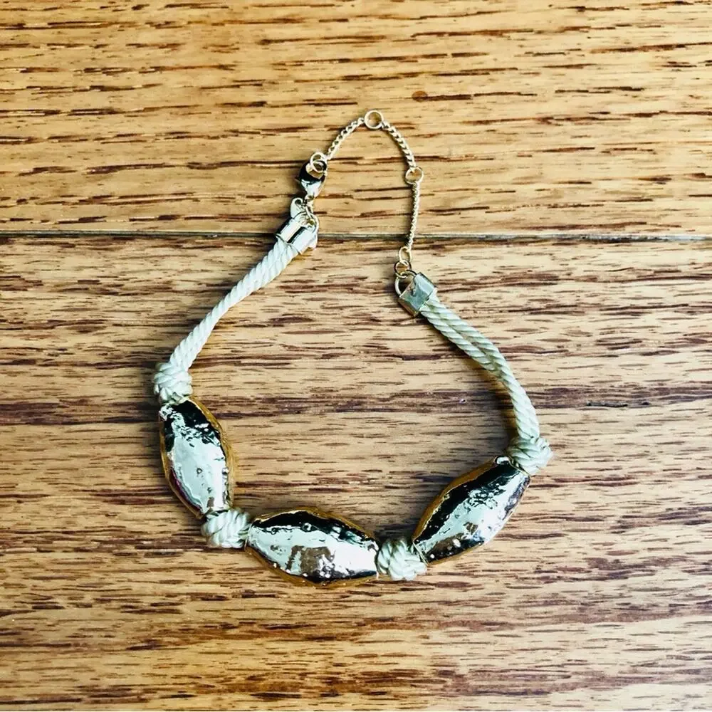 Anthropologie gold toned